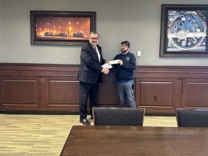 Sutherland volunteer fire department receiving donation check.